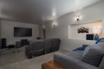 Theater Room offers a large flat screen TV, surround sound, comfy reclining theater seating, bean bag chairs and a queen-size fold out sofa bed